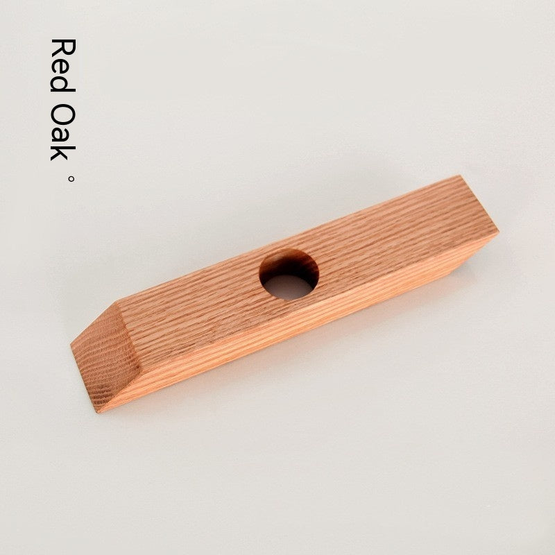 82. Vinflaskhållare av trä