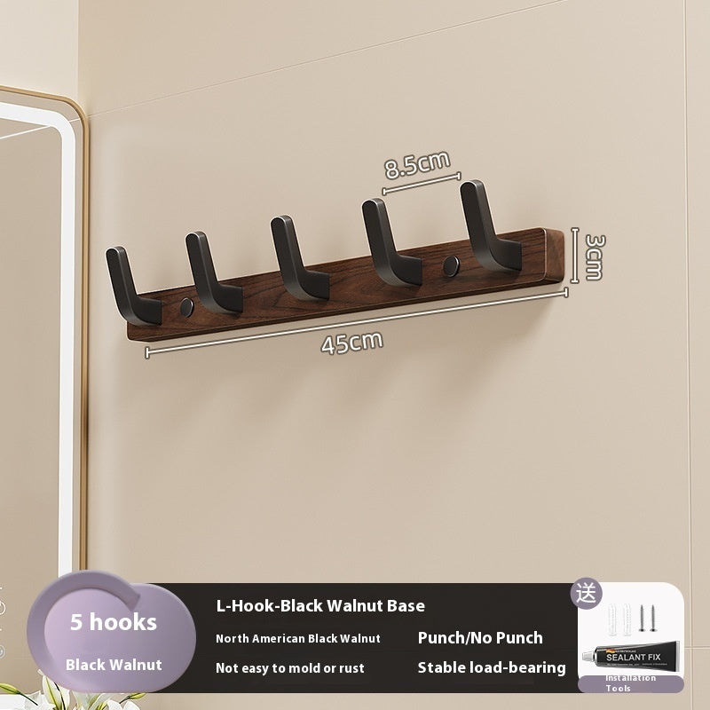 23. Väggmonterad hängare av trä