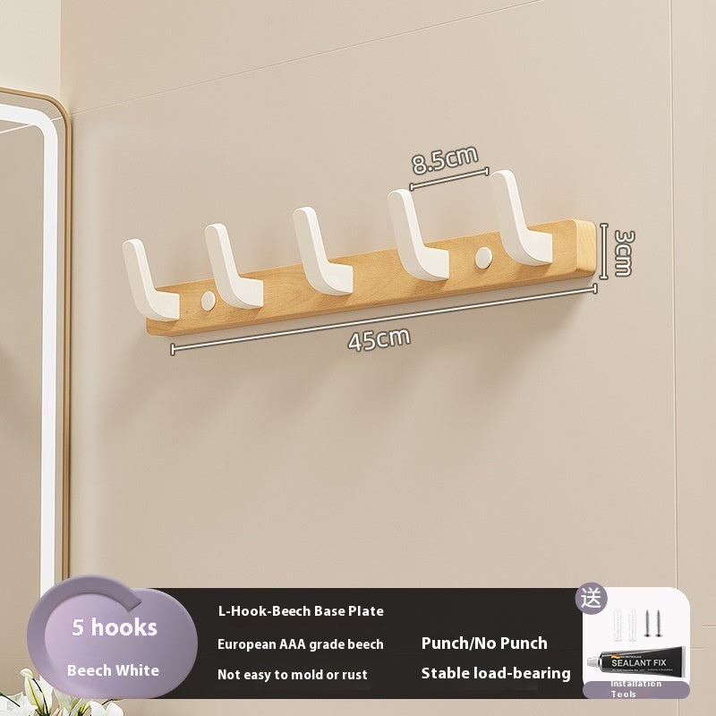 23. Väggmonterad hängare av trä